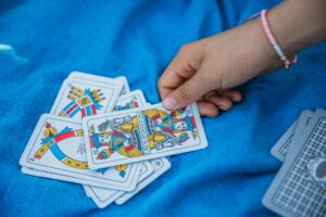 Colorful trading cards spread across a table showing the collectible card game experience