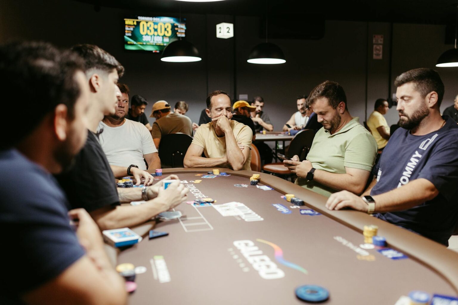 Why Pokemon Company’s Trading Card Tournaments Are Outdrawing Esports Events Trading cards spread across tournament table with competitive players in background