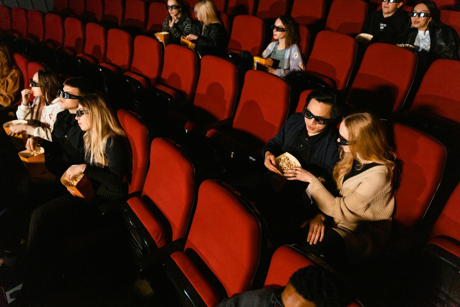 Cinema interior showing movie screens and seating representing Nintendo's film expansion