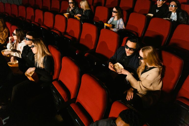 Cinema interior showing movie screens and seating representing Nintendo's film expansion