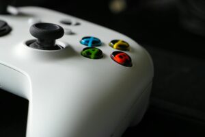 Gaming controller on desk representing video game development and indie gaming partnerships