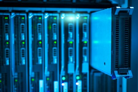 Modern server infrastructure with rows of computing equipment in a data center