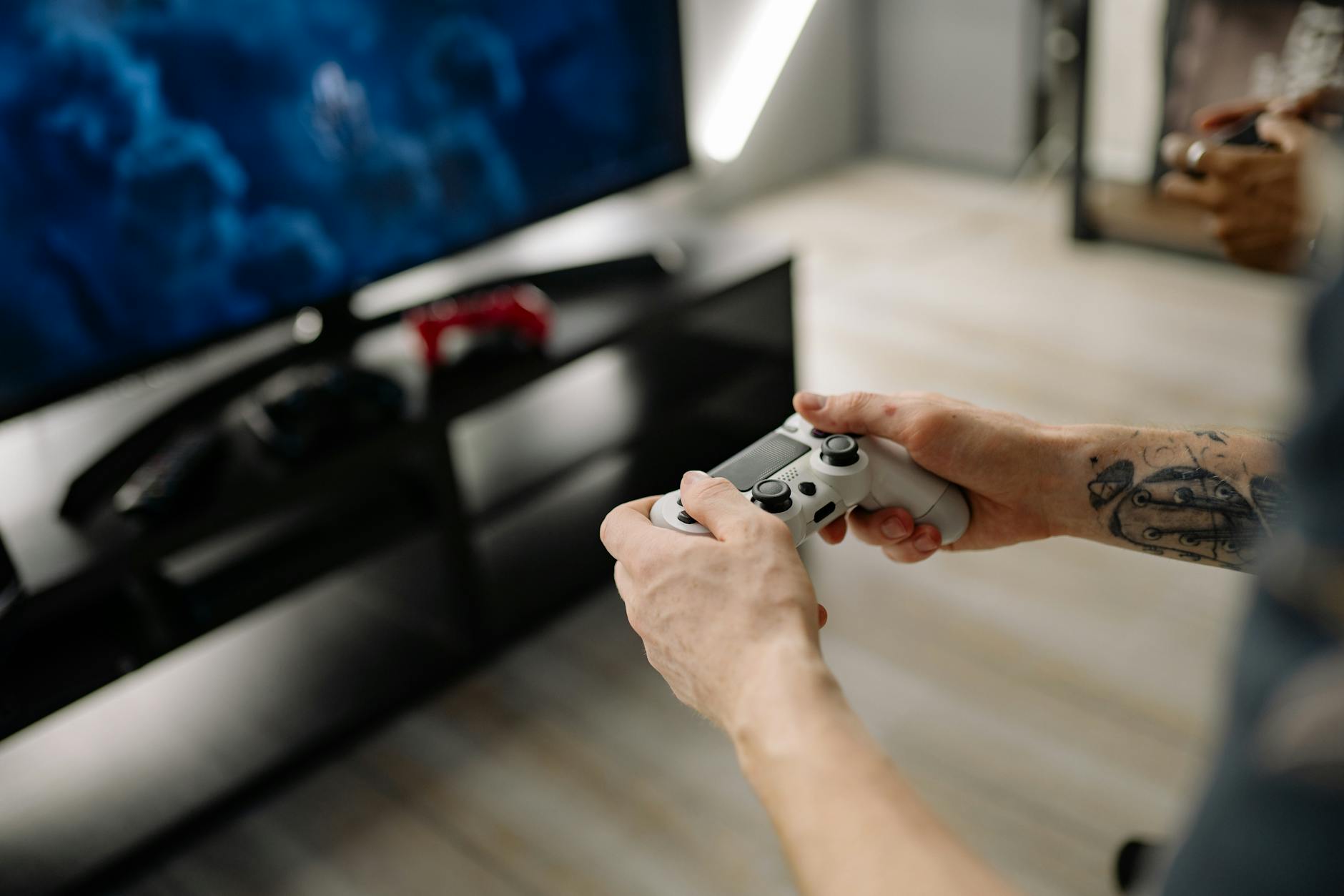 Modern gaming console setup with multiple controllers and games