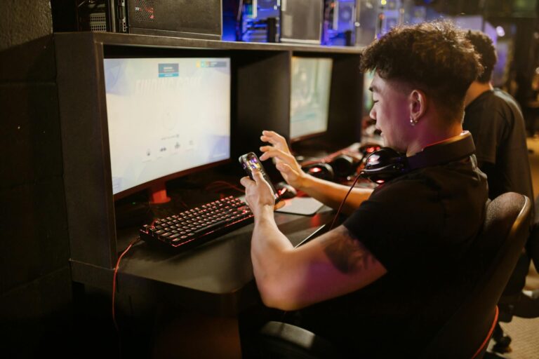 Mobile phone displaying gaming content on screen with colorful interface