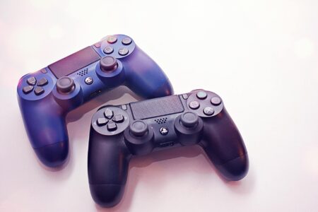 Modern gaming controller on dark surface representing console gaming subscriptions