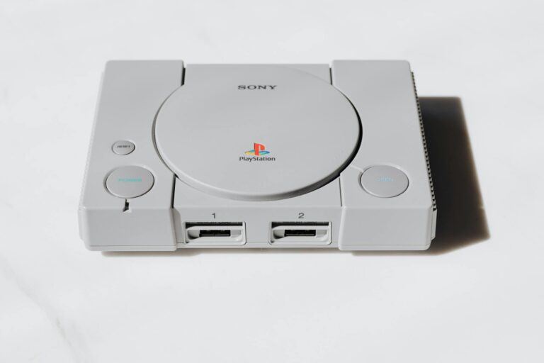 Modern gaming console on wooden surface showing handheld gaming device