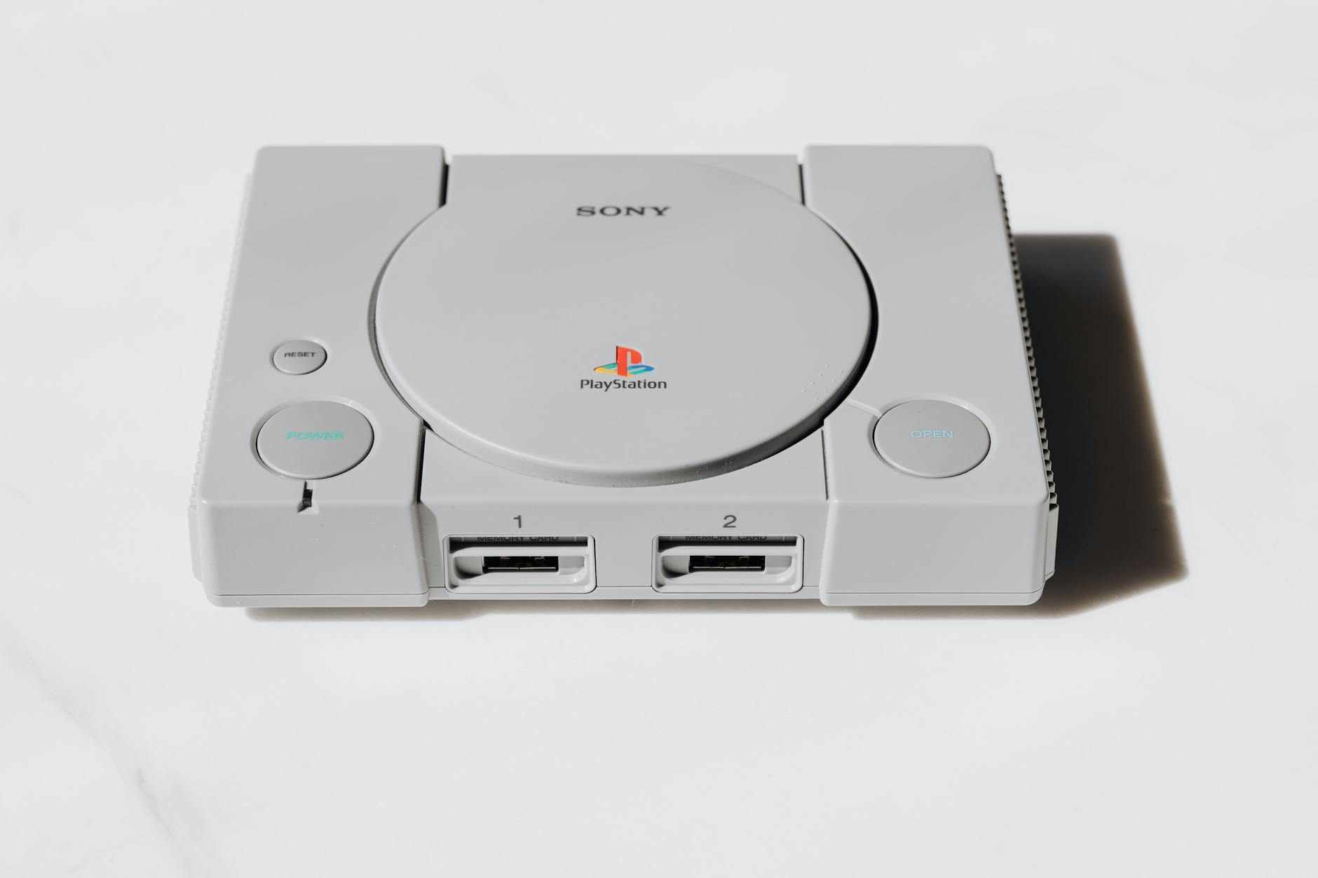 Modern gaming console on wooden surface showing handheld gaming device