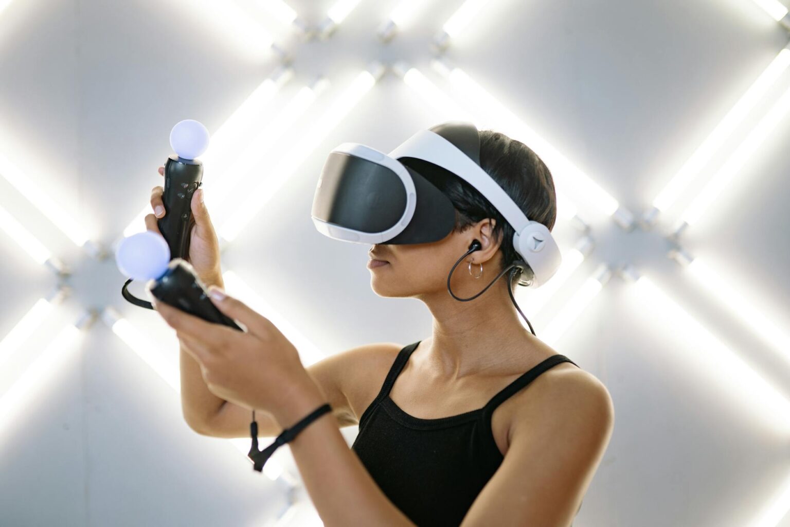 Why PlayStation VR2 Games Are Moving to Meta Quest Person wearing virtual reality headset while gaming
