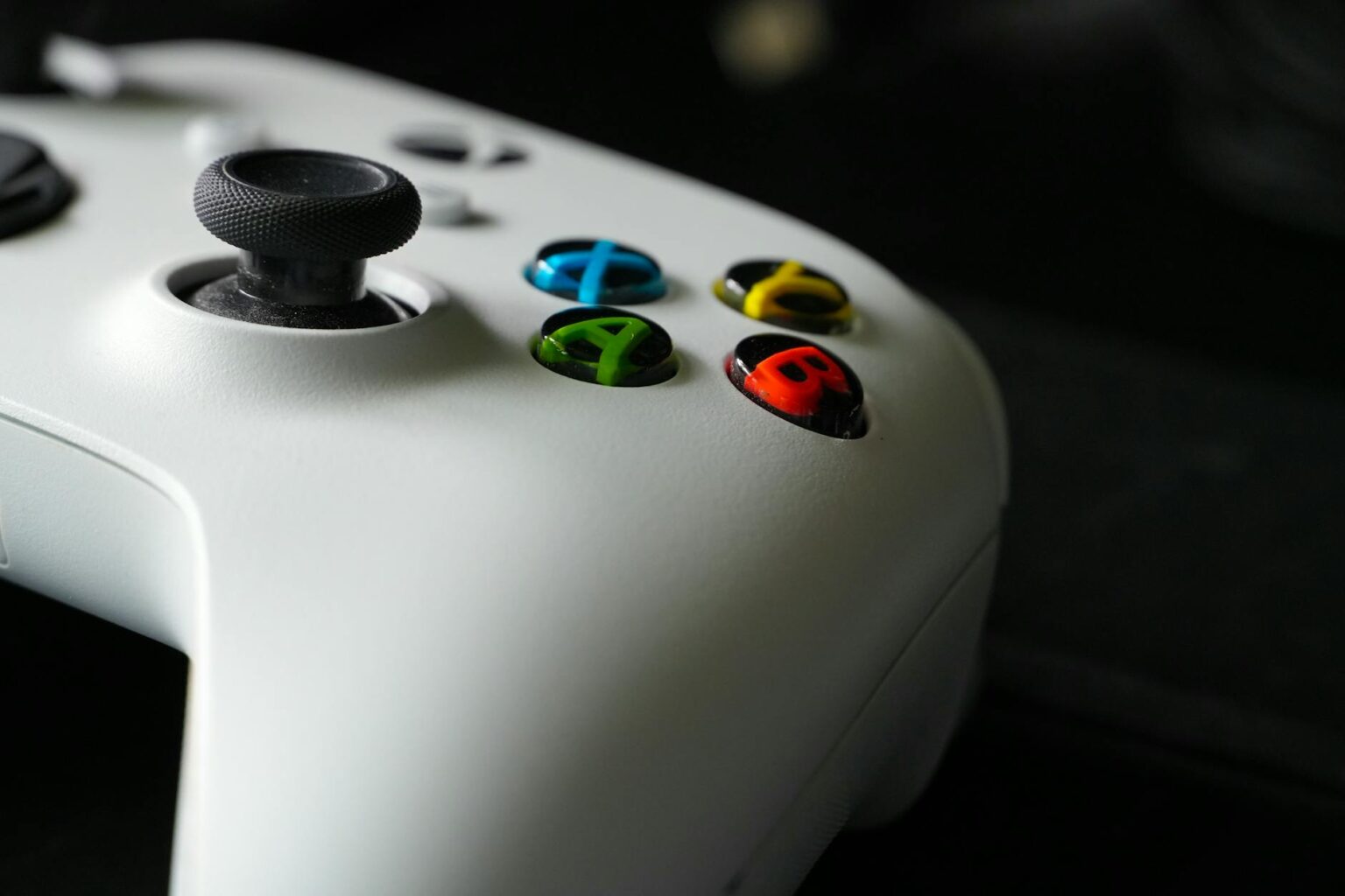 How Xbox’s AI-Powered Achievement System Is Personalizing Gaming Milestones Modern gaming controller on dark surface representing Xbox gaming technology