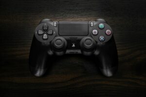 Xbox controller in dramatic lighting suggesting gaming atmosphere