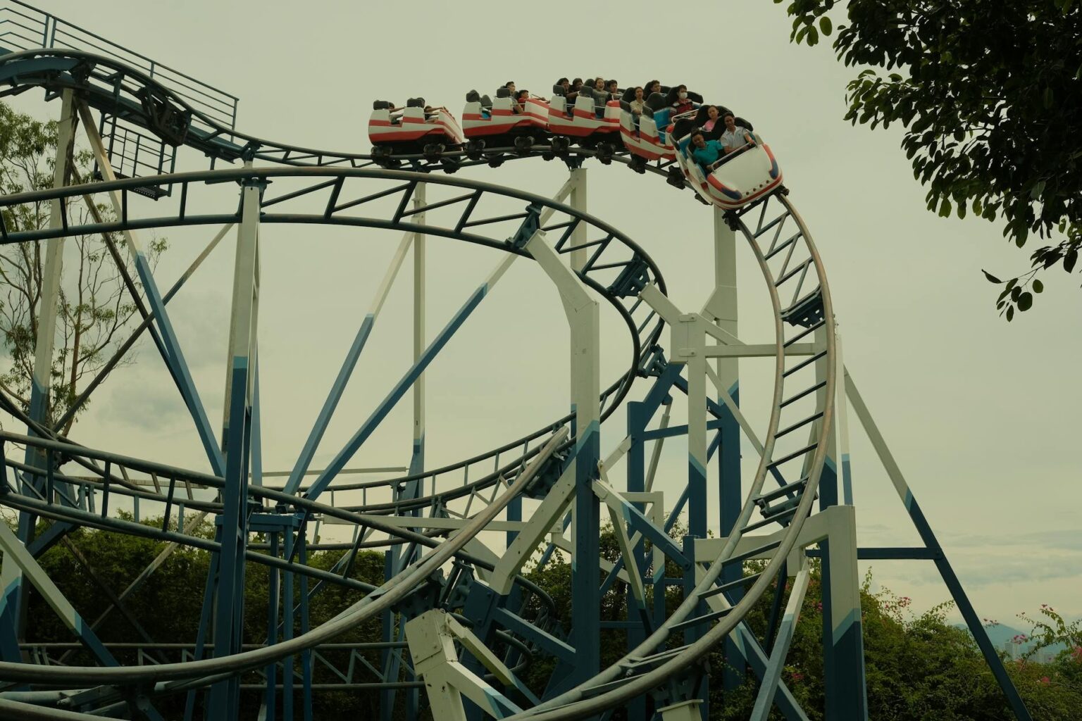 Colorful theme park roller coaster with multiple tracks and exciting loops