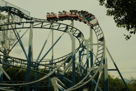 Colorful theme park roller coaster with multiple tracks and exciting loops
