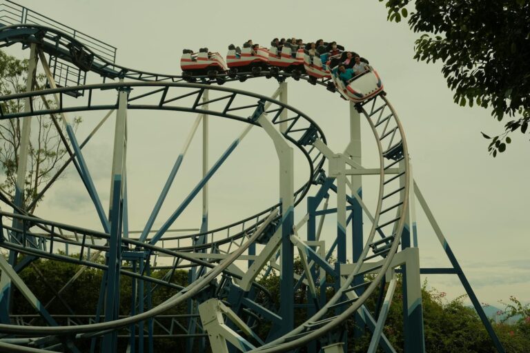 Colorful theme park roller coaster with multiple tracks and exciting loops