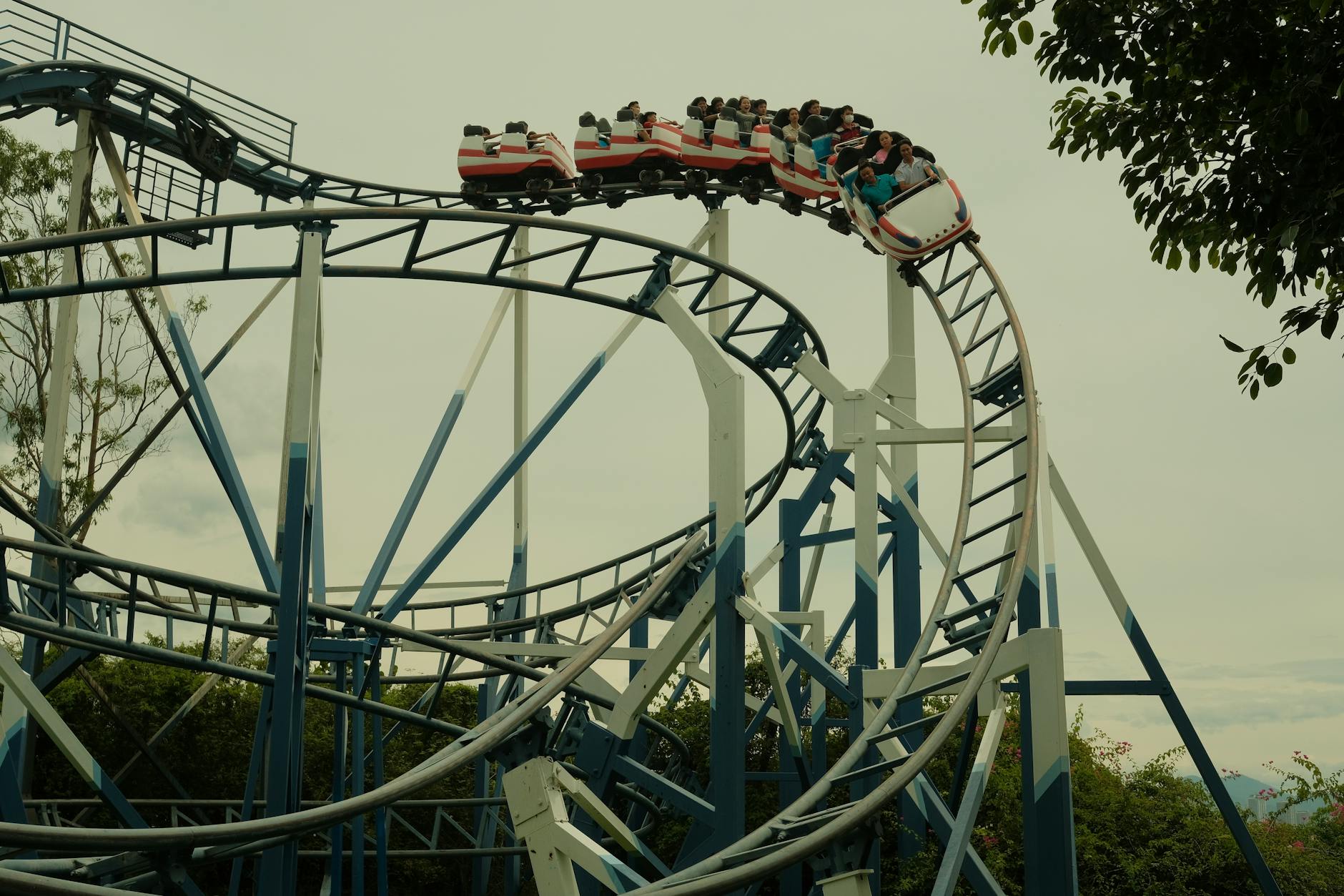 Colorful theme park roller coaster with multiple tracks and exciting loops