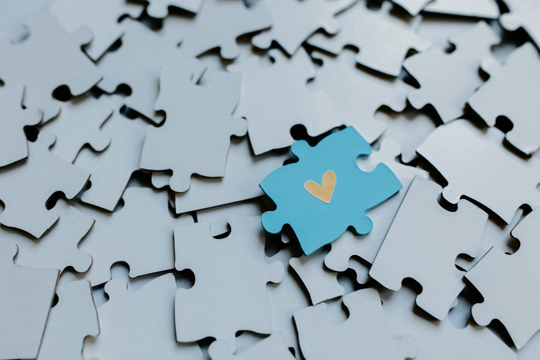 Colorful puzzle pieces fitting together representing game mechanic integration