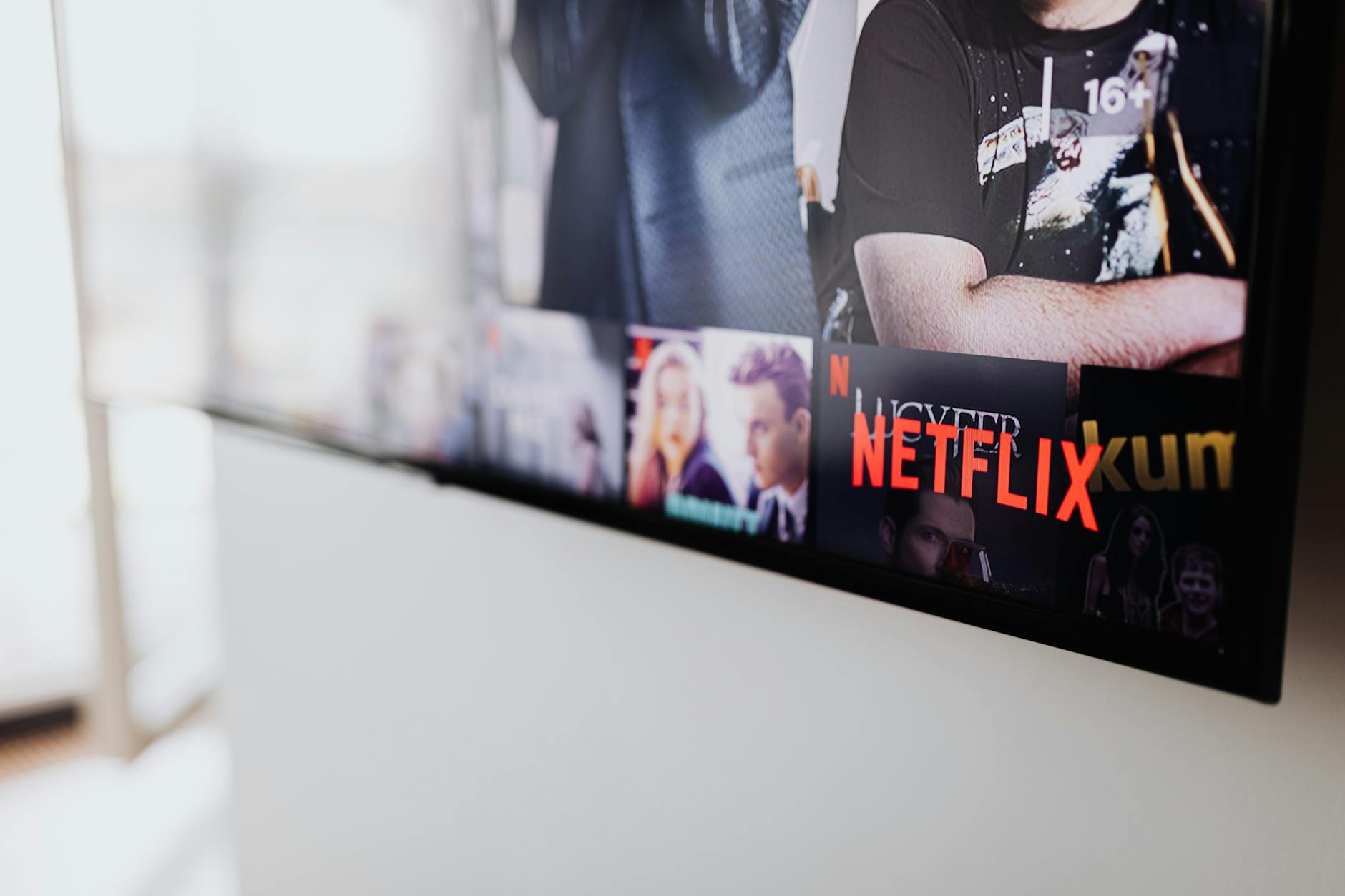 Modern entertainment setup with multiple screens showing streaming content