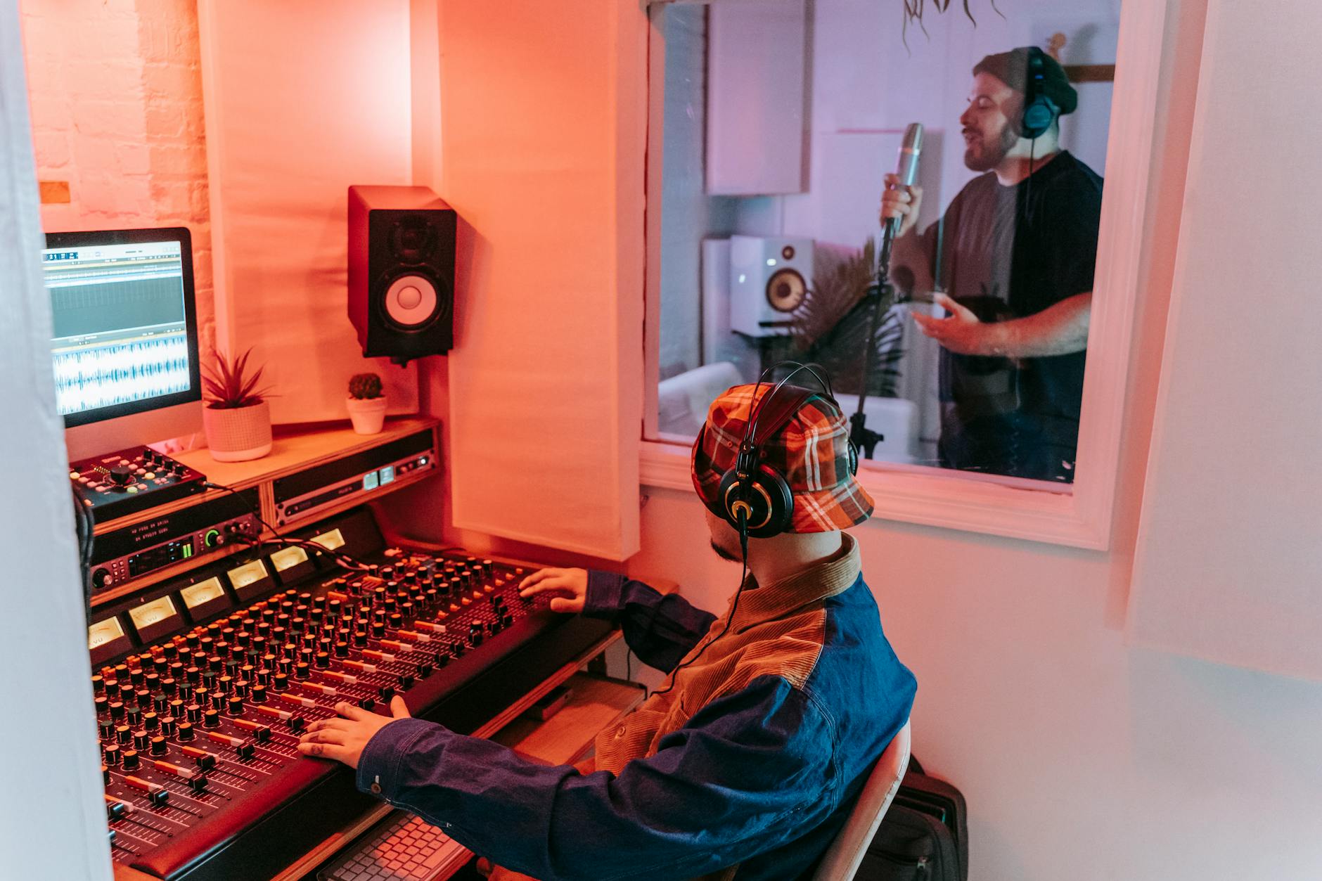 Professional music production studio with mixing board and monitors