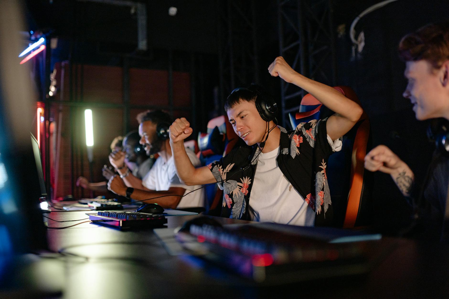 Large crowd watching esports tournament on big screens