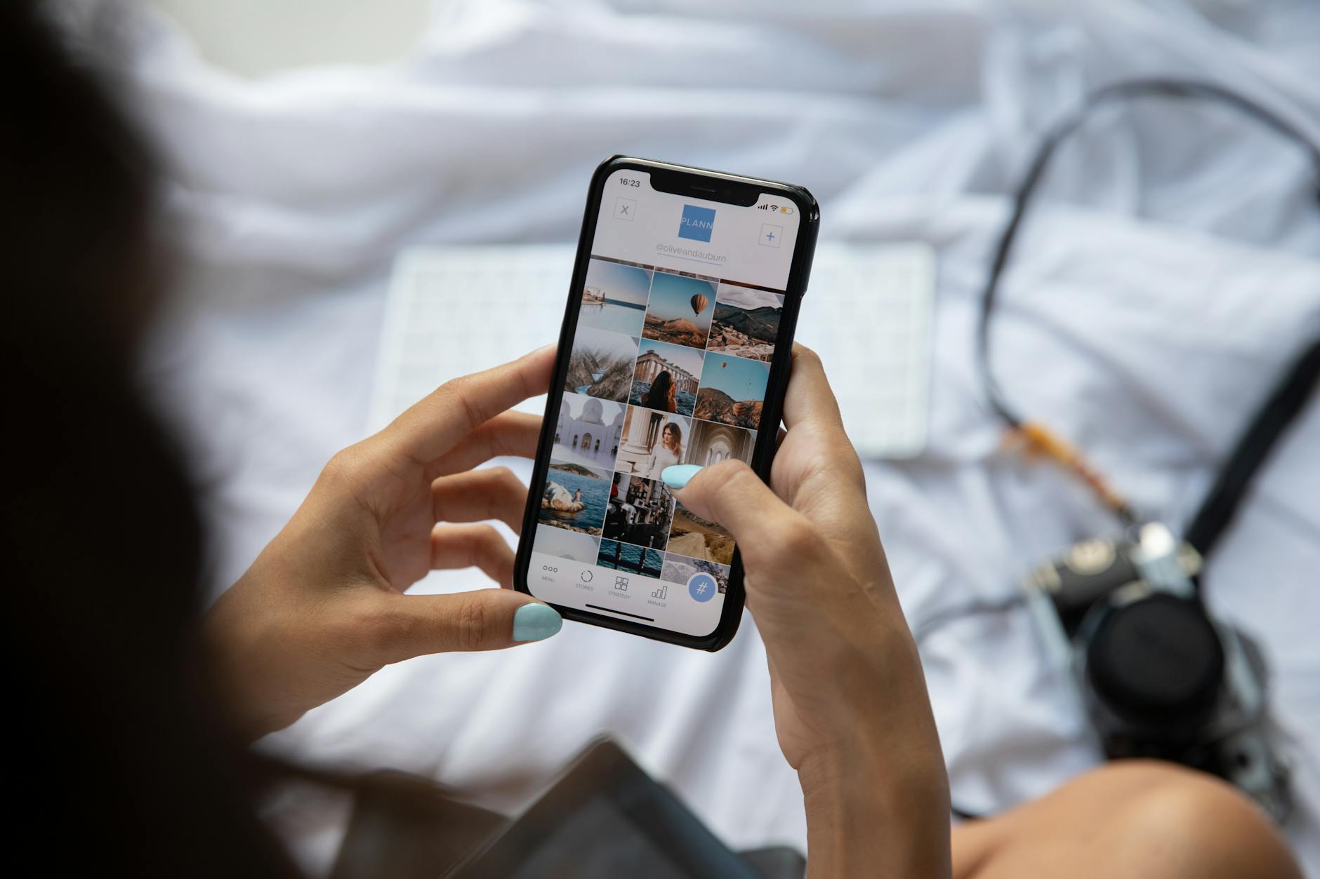 Person taking photo of prepared food dish with smartphone for social media sharing