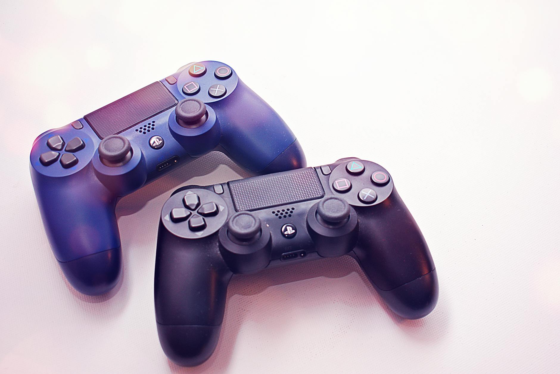 Modern gaming console controller on wooden surface