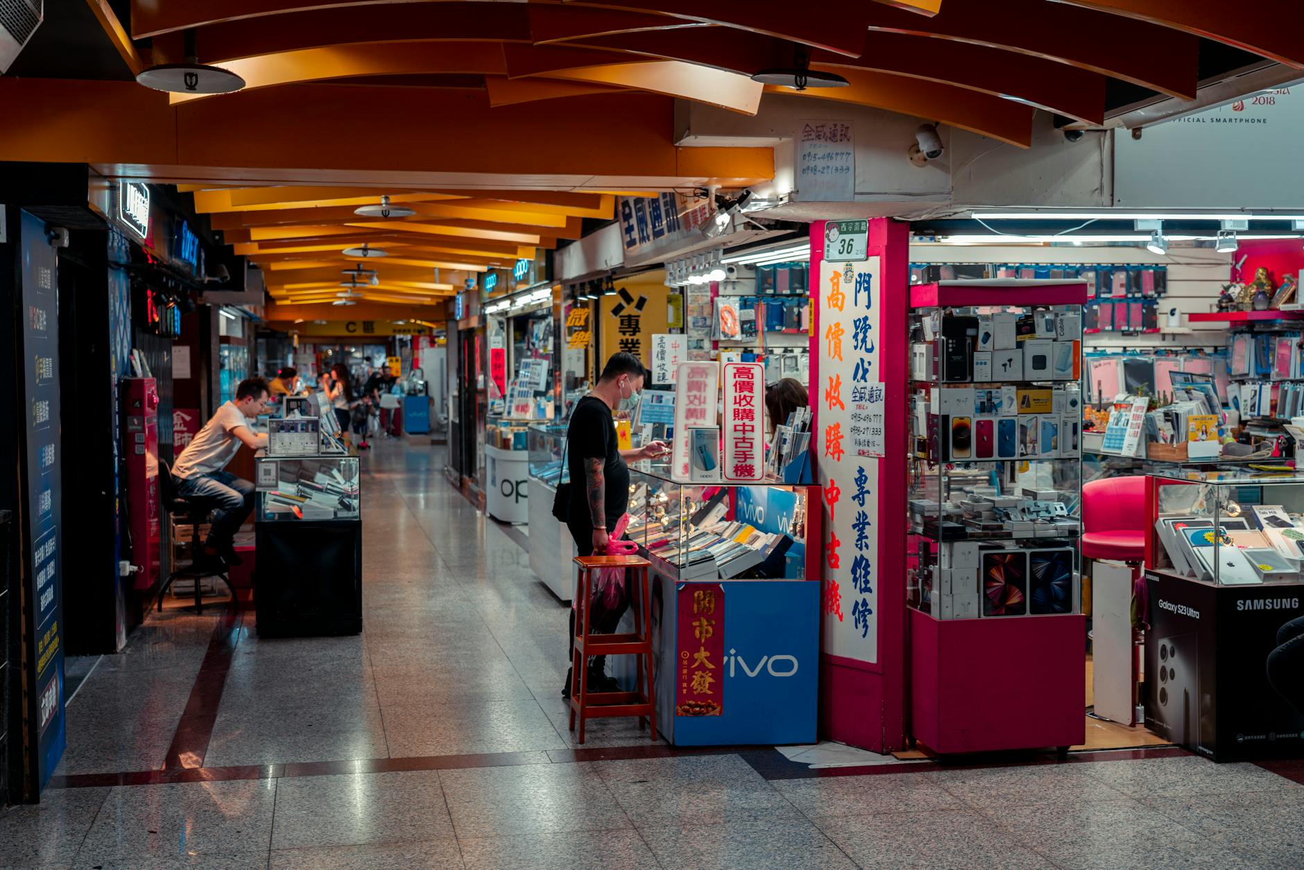 Electronics marketplace scene showing gaming hardware and accessories for sale