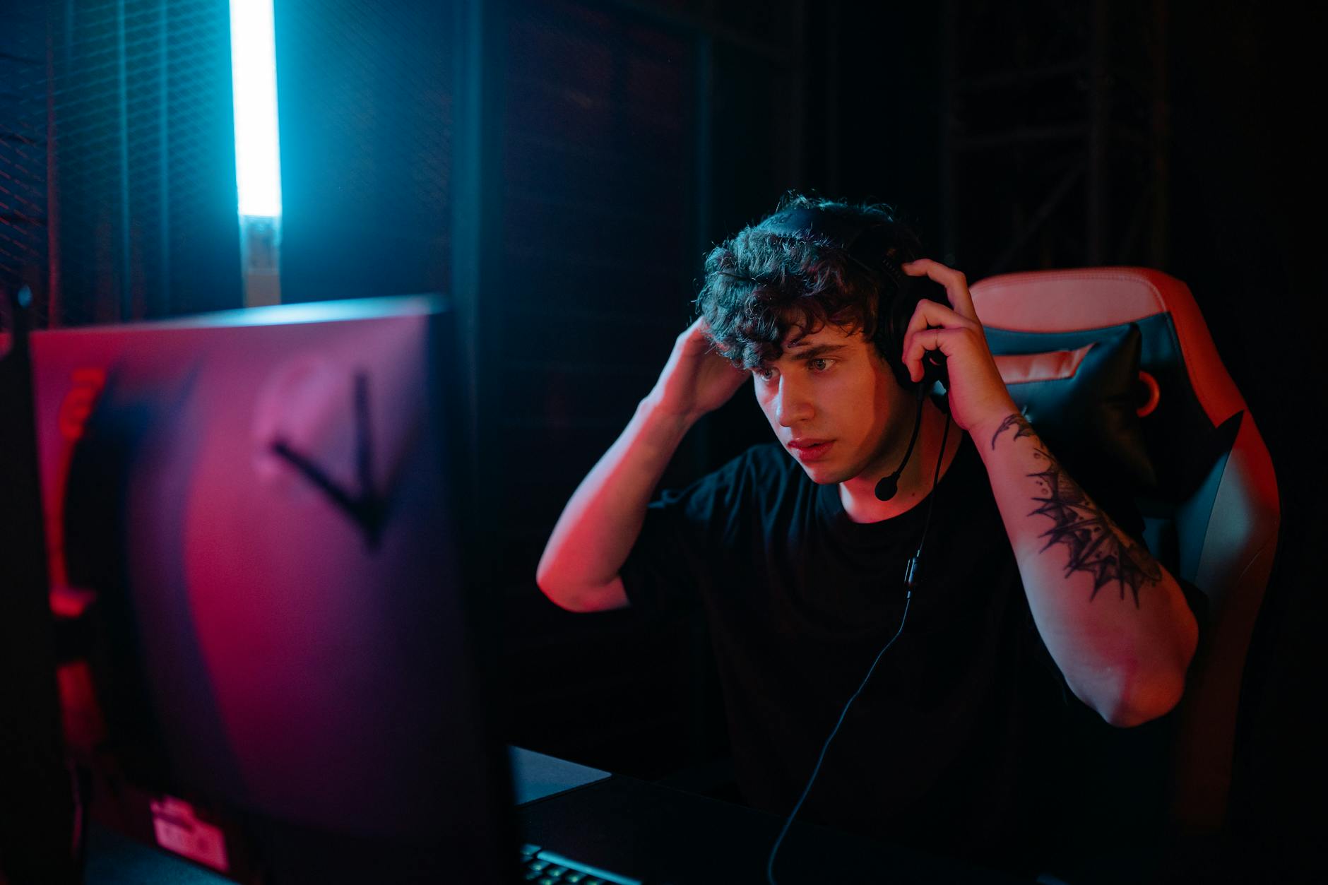 Gaming headset on desk showing audio equipment used for gaming and podcast consumption  