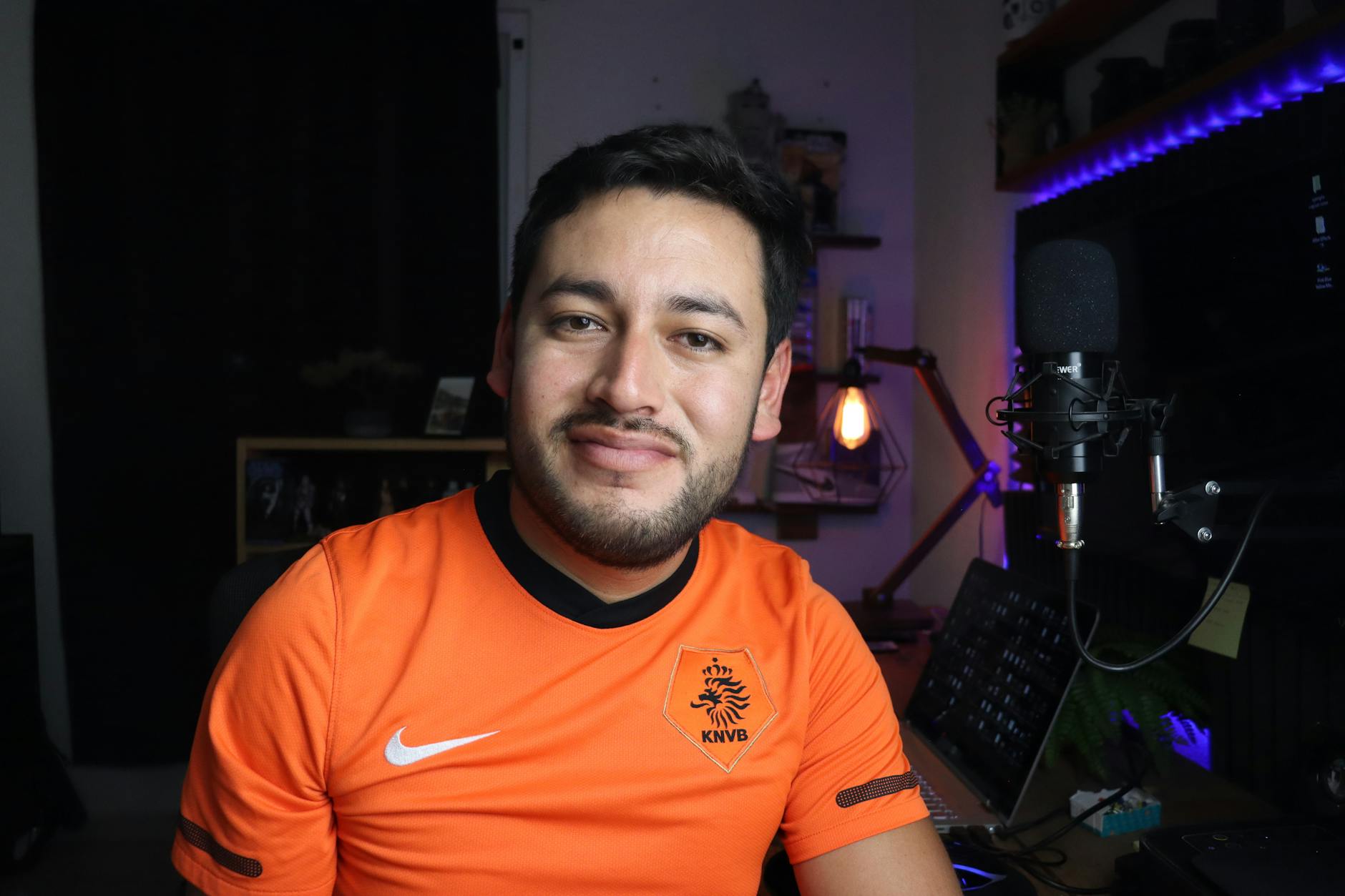 Content creator recording gaming video in professional home studio setup