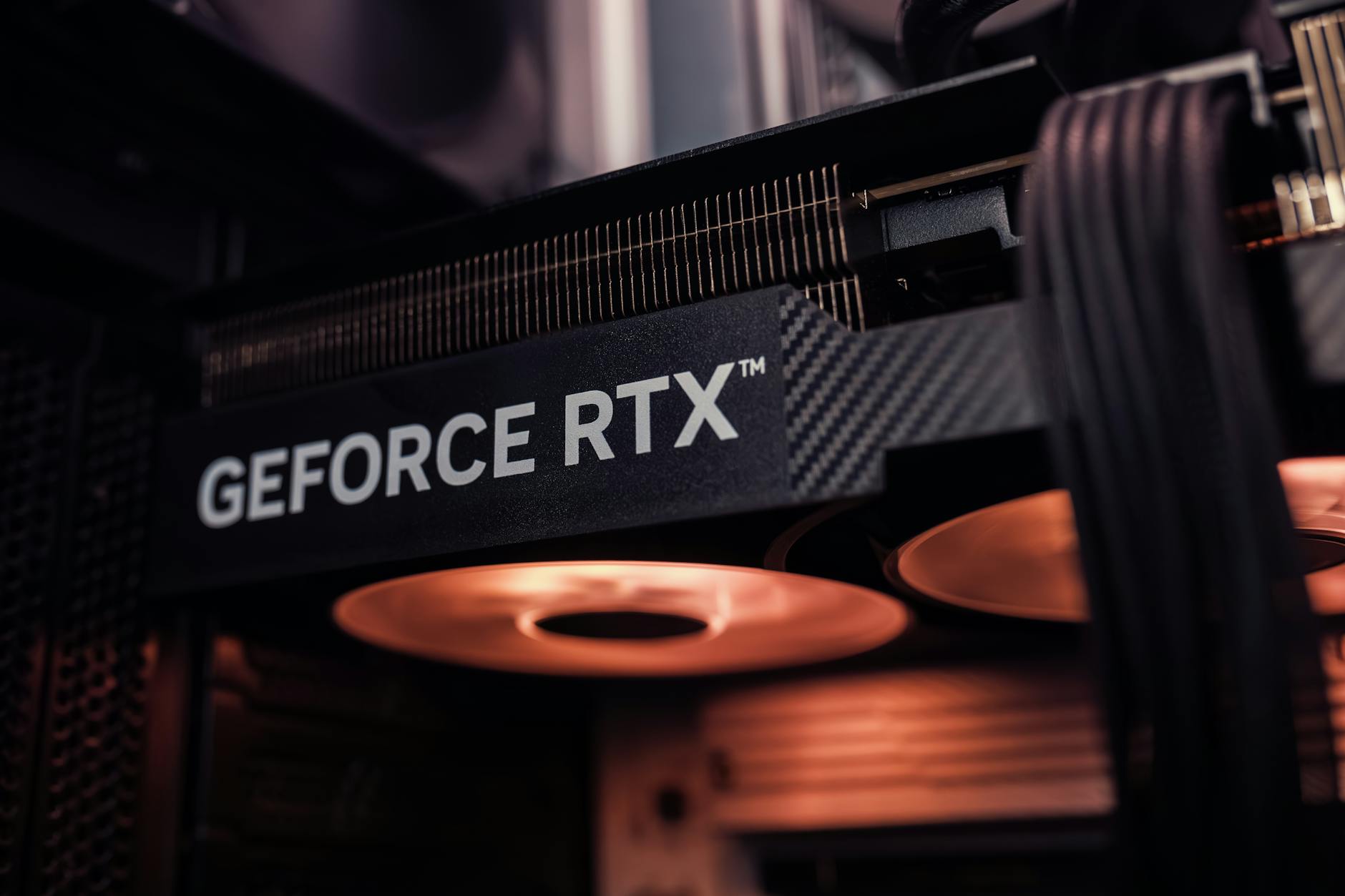 Close-up view of modern graphics card with cooling fans and circuitry