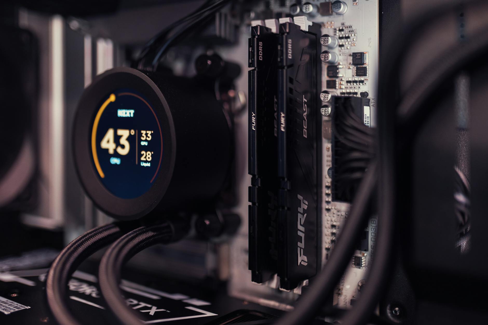 Close-up of graphics card and CPU cooler inside gaming computer case