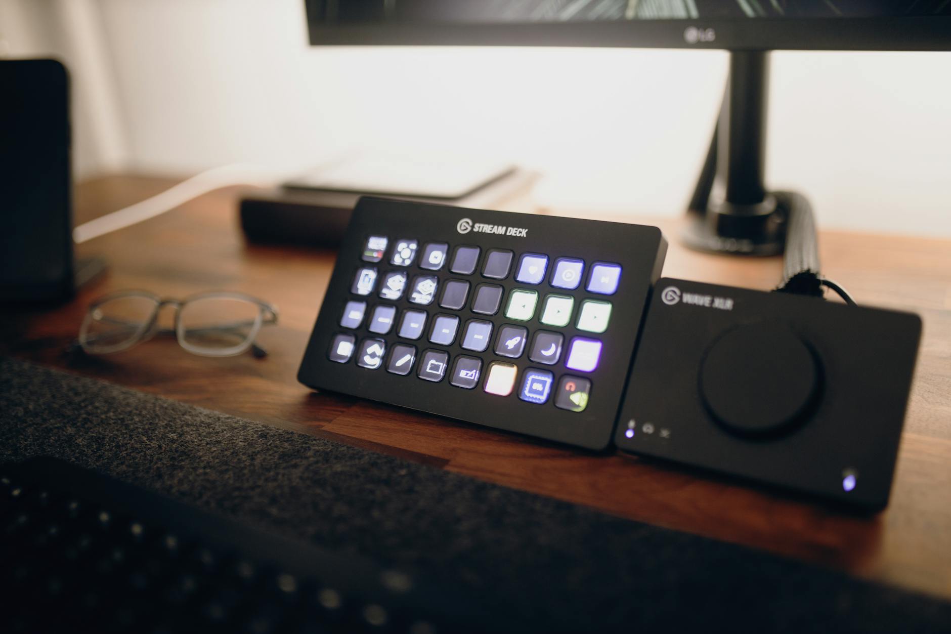 Person streaming content on computer with webcam and professional streaming software interface