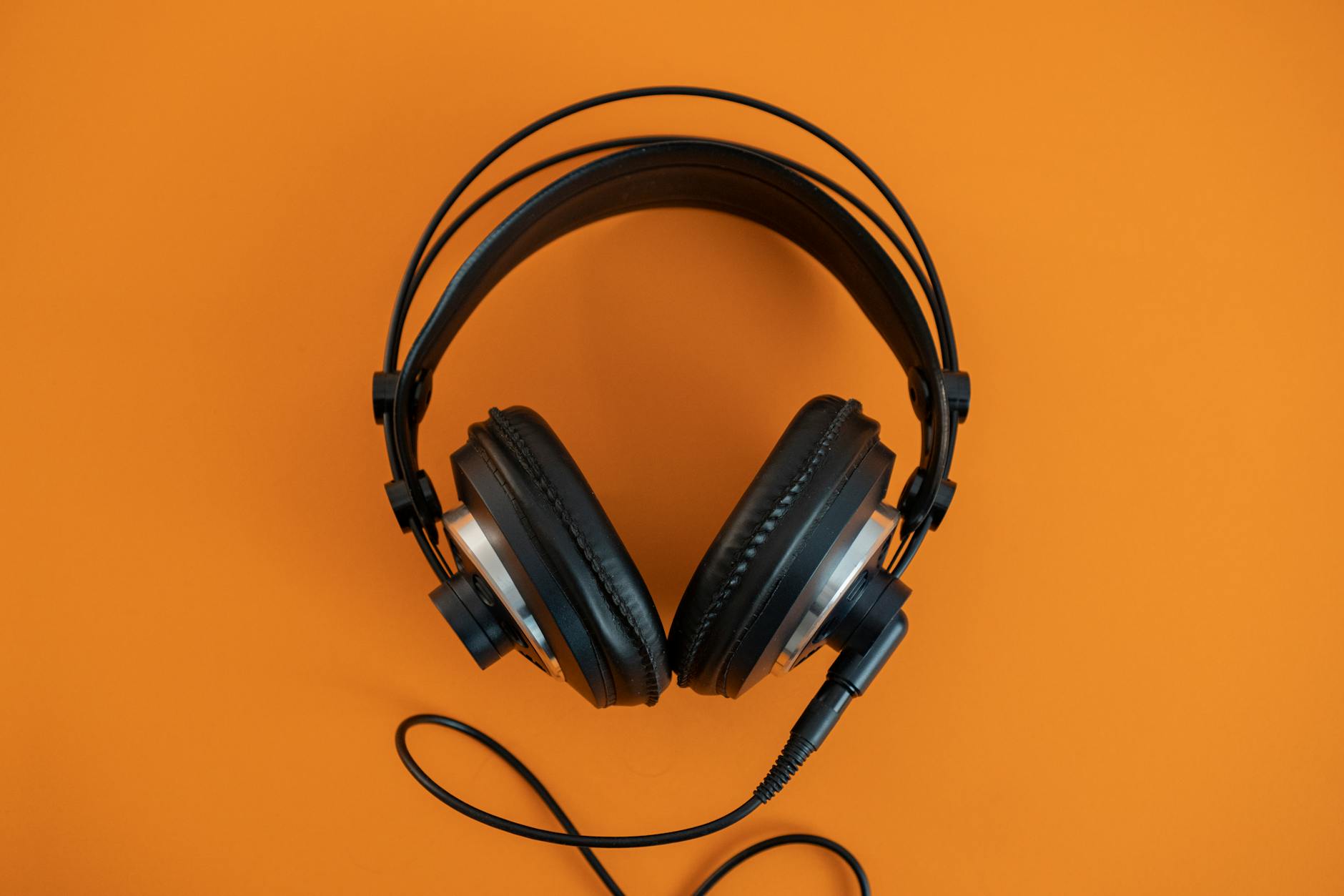 Close-up view of professional headphones showing audio technology details