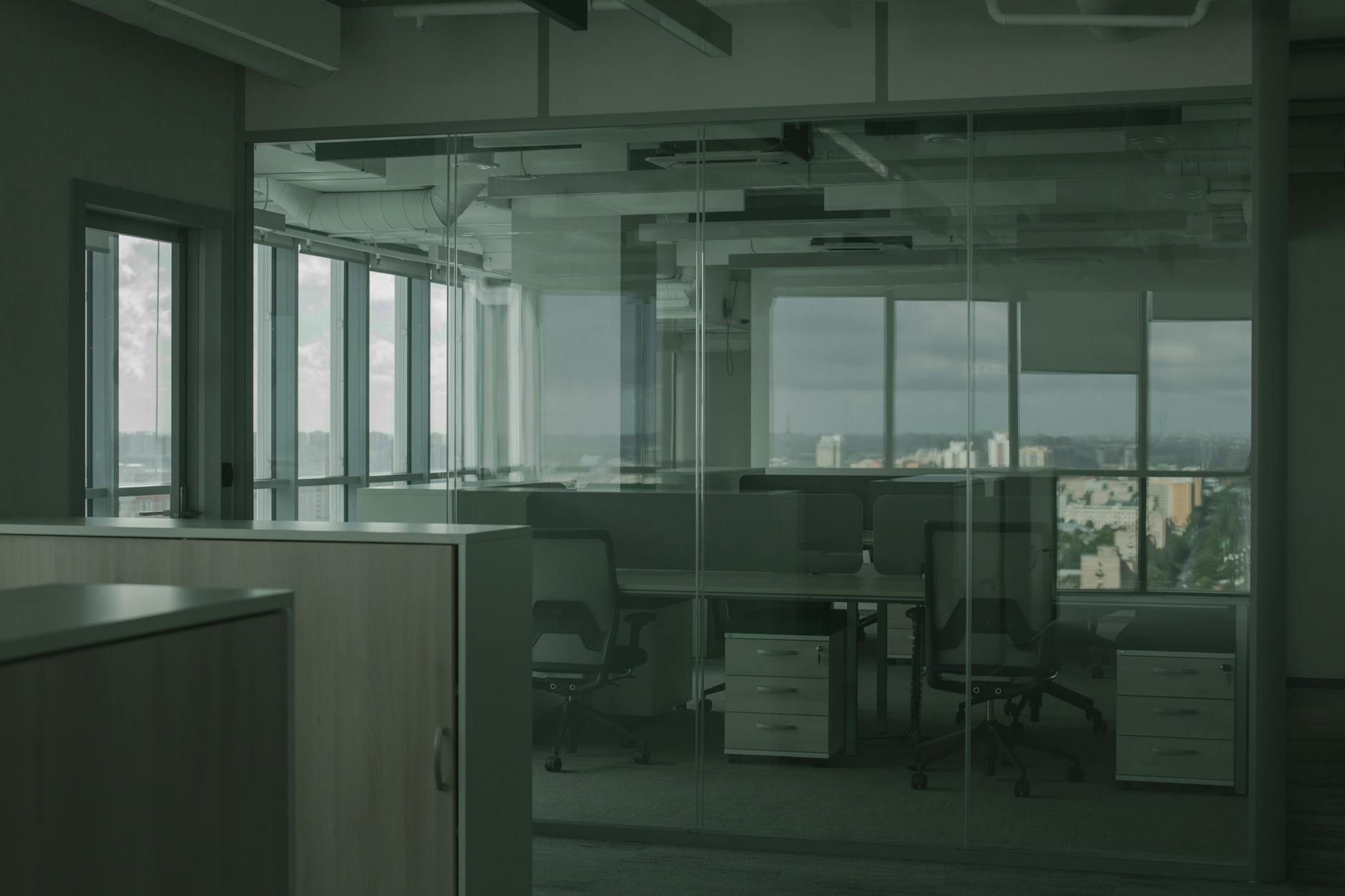 Empty modern office space with gaming chairs and desks, representing abandoned gaming house facilities
