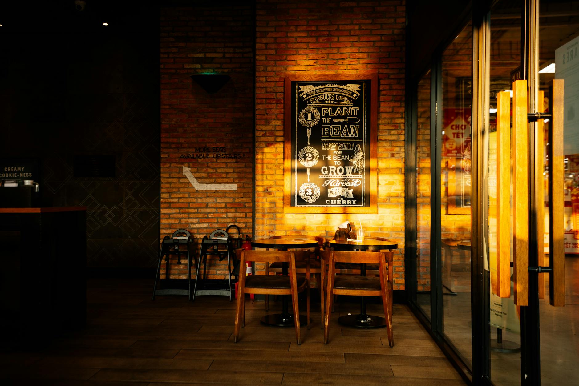Modern cafe interior with retro gaming setups and comfortable seating areas