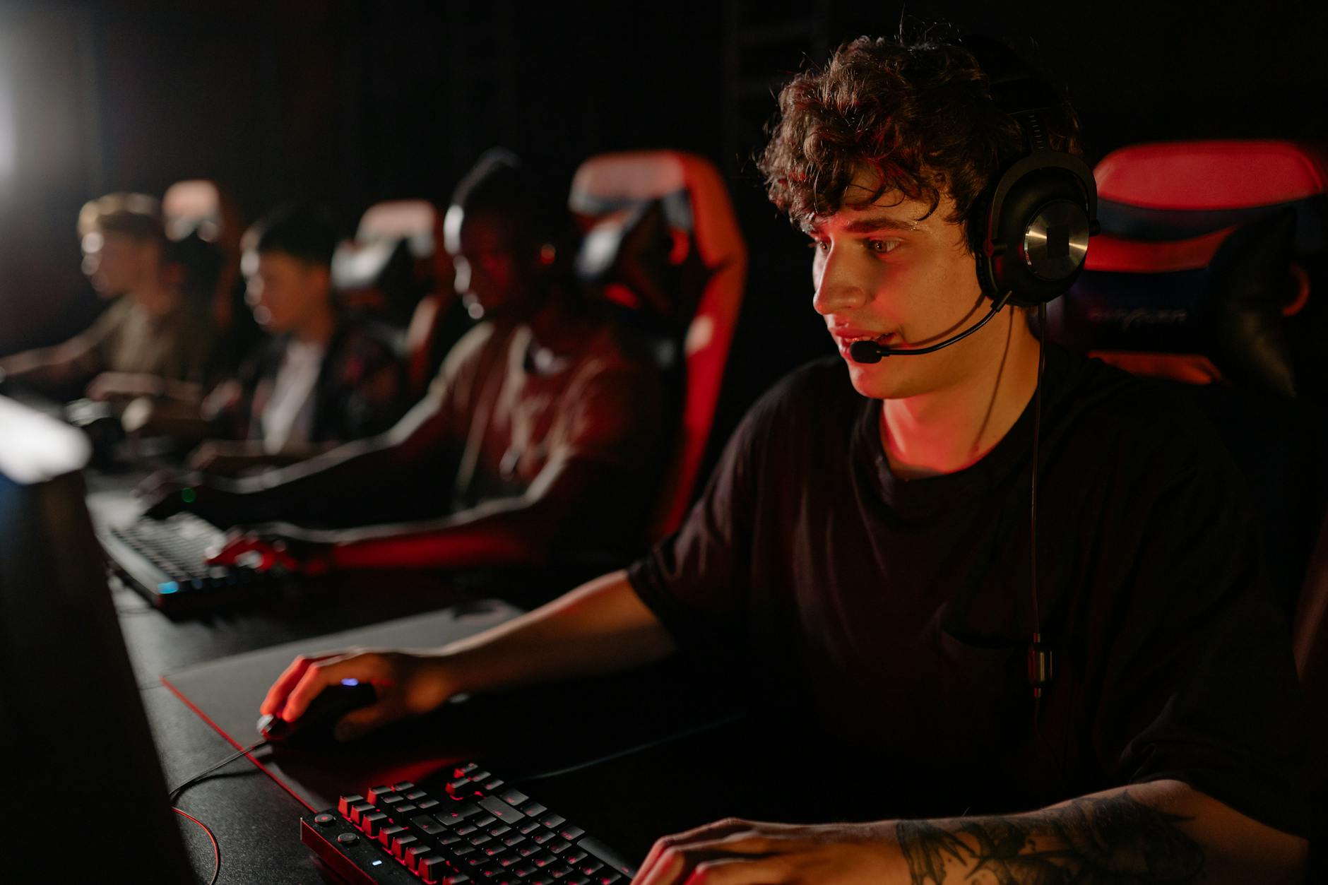 Competitive gaming setup with multiple screens and professional gaming equipment for esports tournament