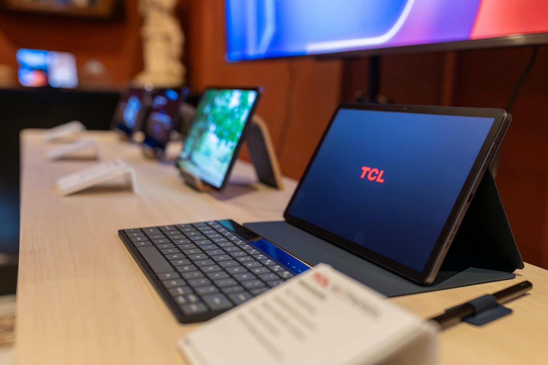 Electronics retail display showcasing gaming devices and consumer technology products