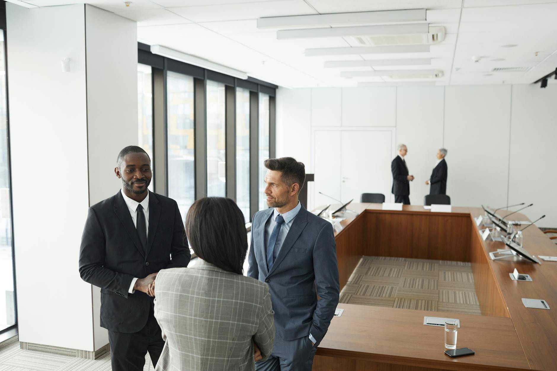 Business professionals in meeting discussing documents and presentations