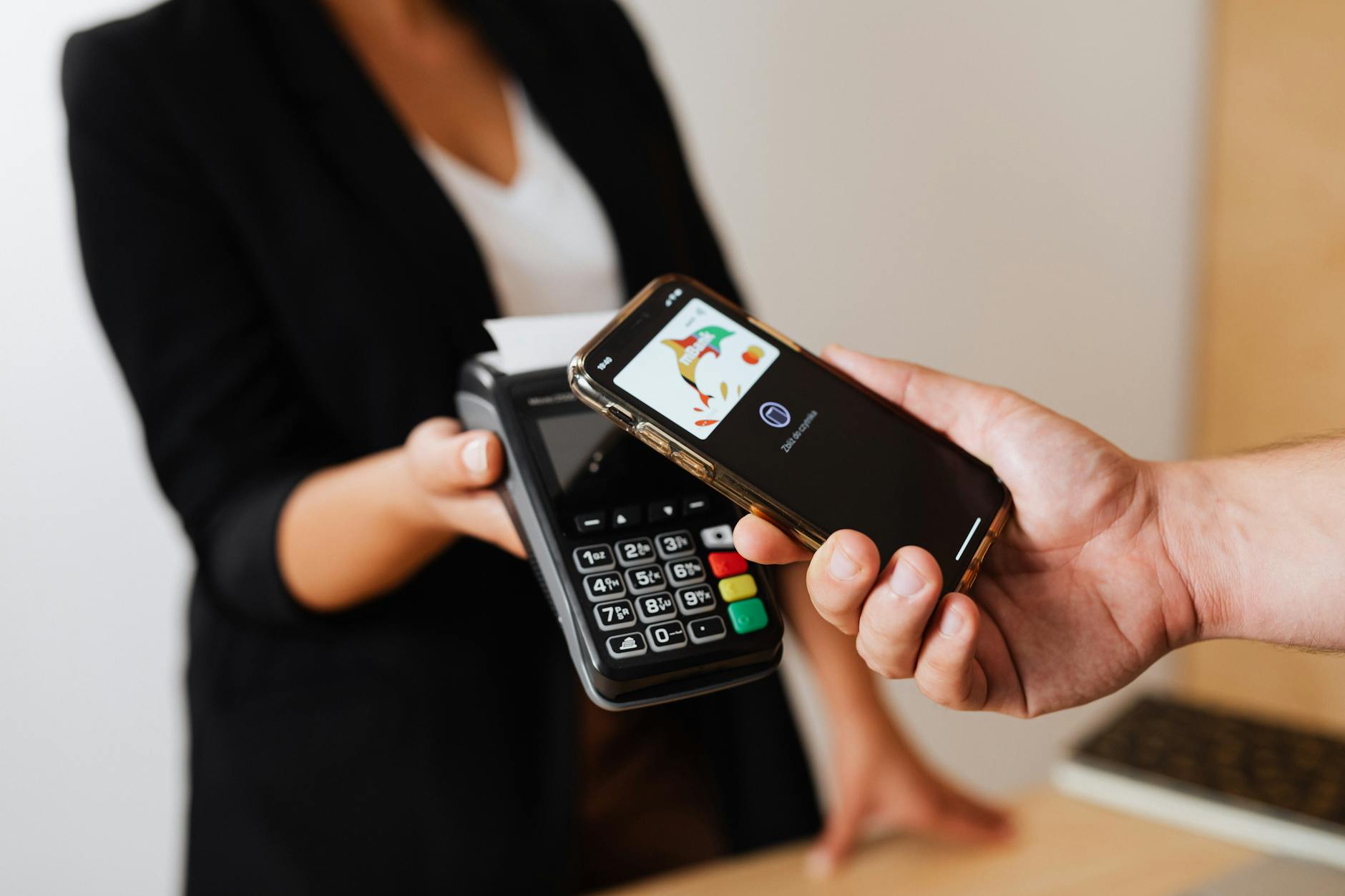 Person using mobile payment technology on smartphone for digital transactions