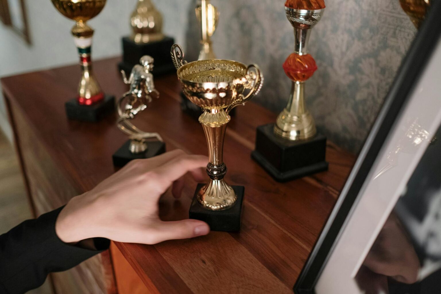 Astro Bot’s Award Sweep Is Complicating PlayStation’s Sequel Plans A shiny gaming award trophy displayed on a shelf, symbolizing game of the year recognition