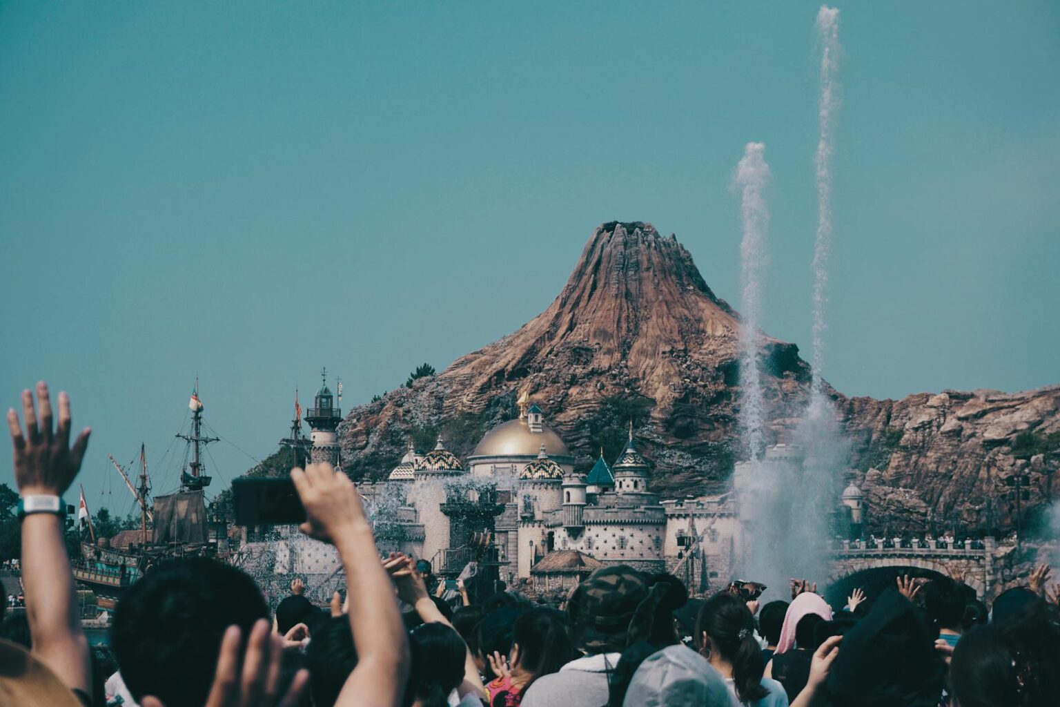 Mario Kart Theme Parks Are Drawing Lines Longer Than Disney Attractions Large crowds of visitors waiting in lines at a busy theme park attraction