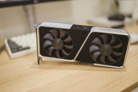 NVIDIA’s RTX 4060 Supply Shortage Is Boosting AMD Graphics Card Sales Close-up of a modern graphics card installed in a gaming PC build