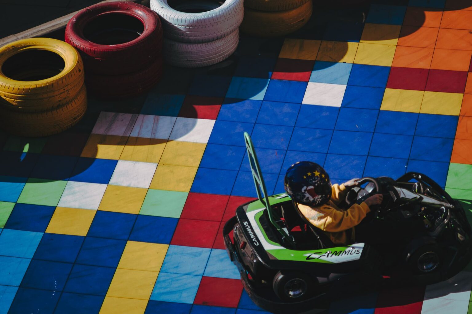 A winding kart racing track viewed from above, representing competitive racing game design