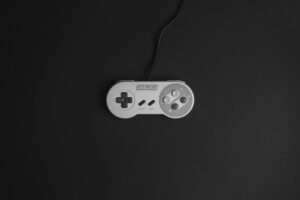 A game controller resting in dim lighting, symbolizing anticipation and waiting