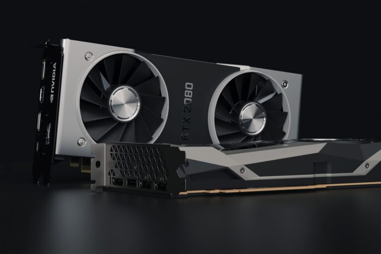 A modern graphics card displayed on a dark surface highlighting its cooling design