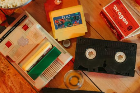 A collection of video game cartridges arranged on a shelf representing physical game collecting