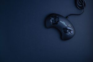 A vintage video game controller resting on a surface, representing classic gaming nostalgia