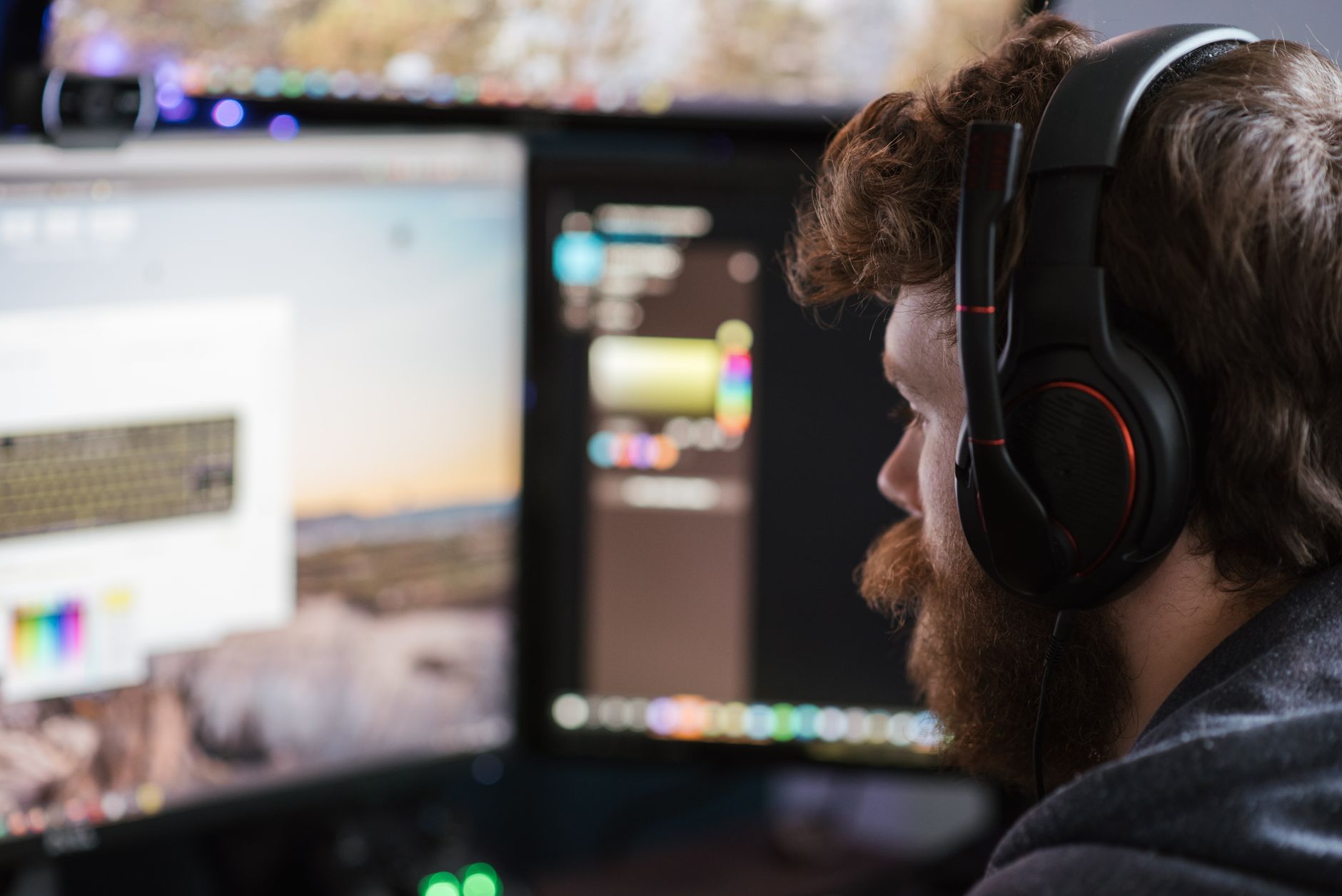 Interior of a game development studio with monitors and design workstations