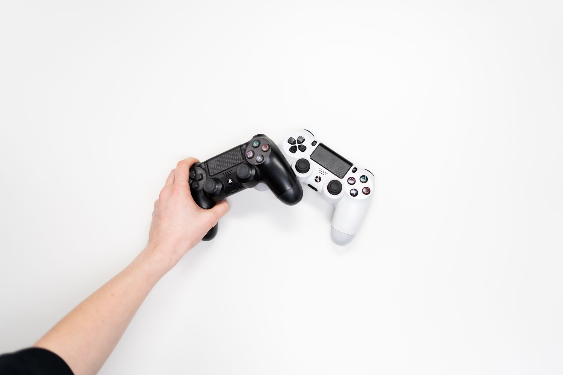 PlayStation controller resting on a desk representing Sony gaming hardware