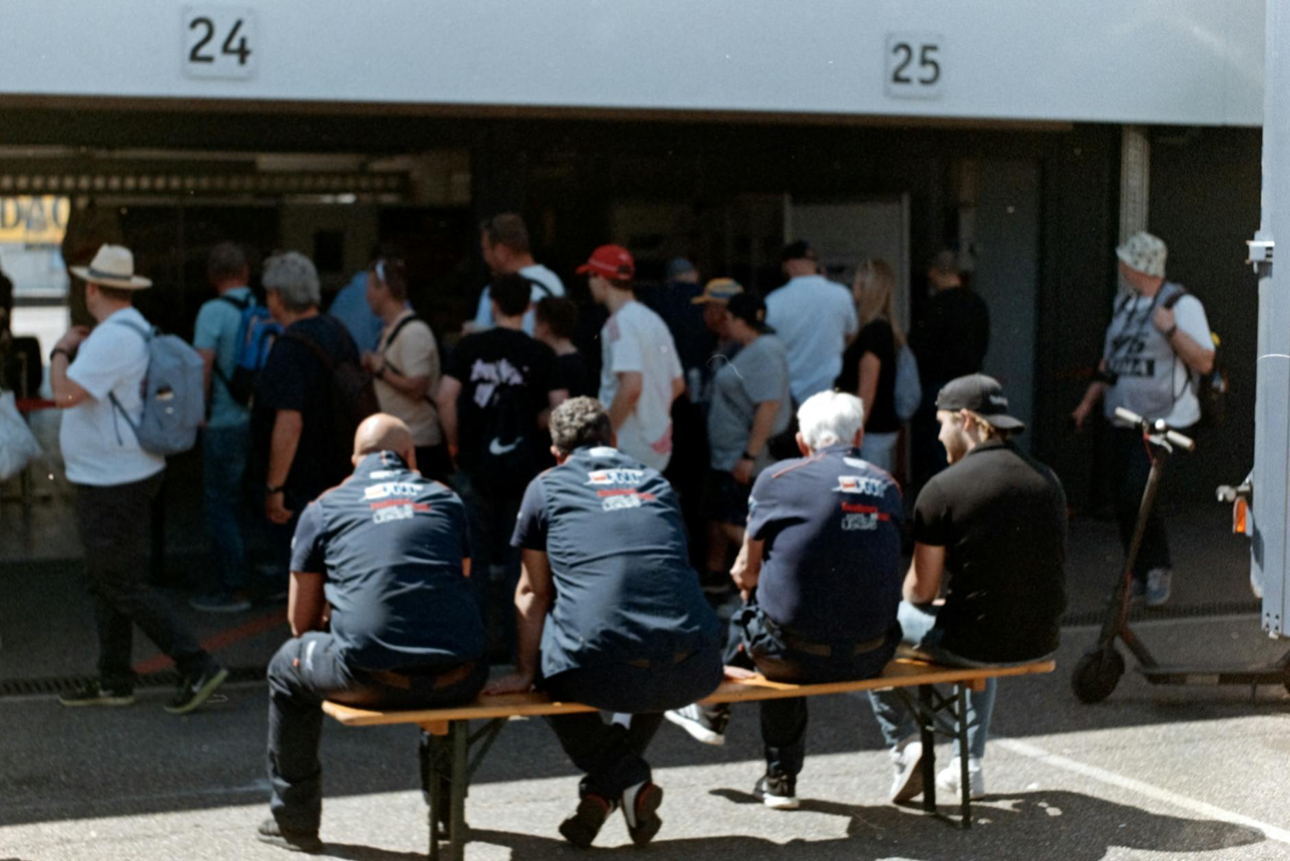 A crowd of people waiting in anticipation at a large event