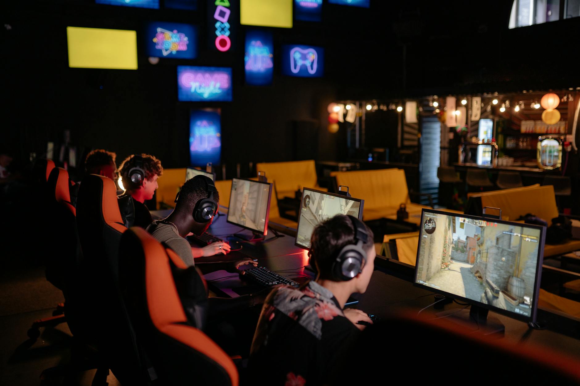Players at a competitive gaming event focused on screens during a timed run