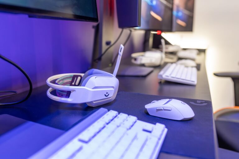 Game developers working at computers inside a modern studio office